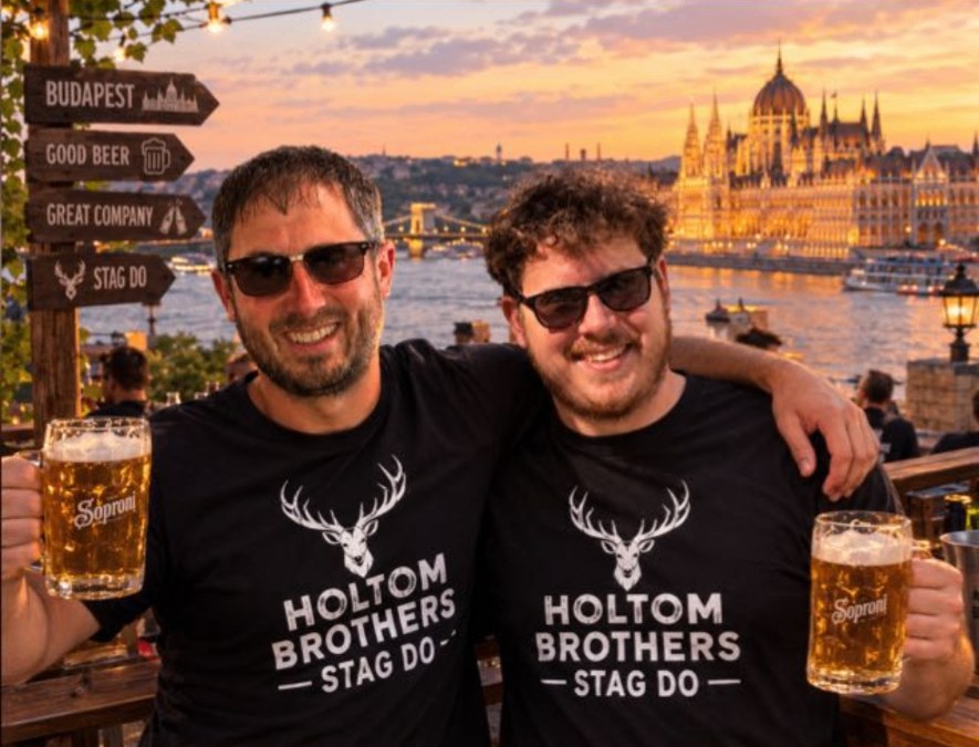 Matt and Will in Holtom Brothers stag t-shirts with beers by the Danube in Budapest